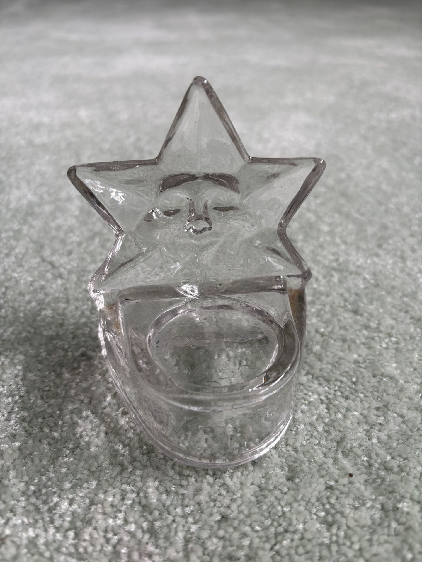 Star Shaped Votive Candle Holder Made Of Glass With A Face Molded Into The Star