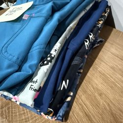 8 Different Medium Size Scrub Tops - All For 20 Dls 