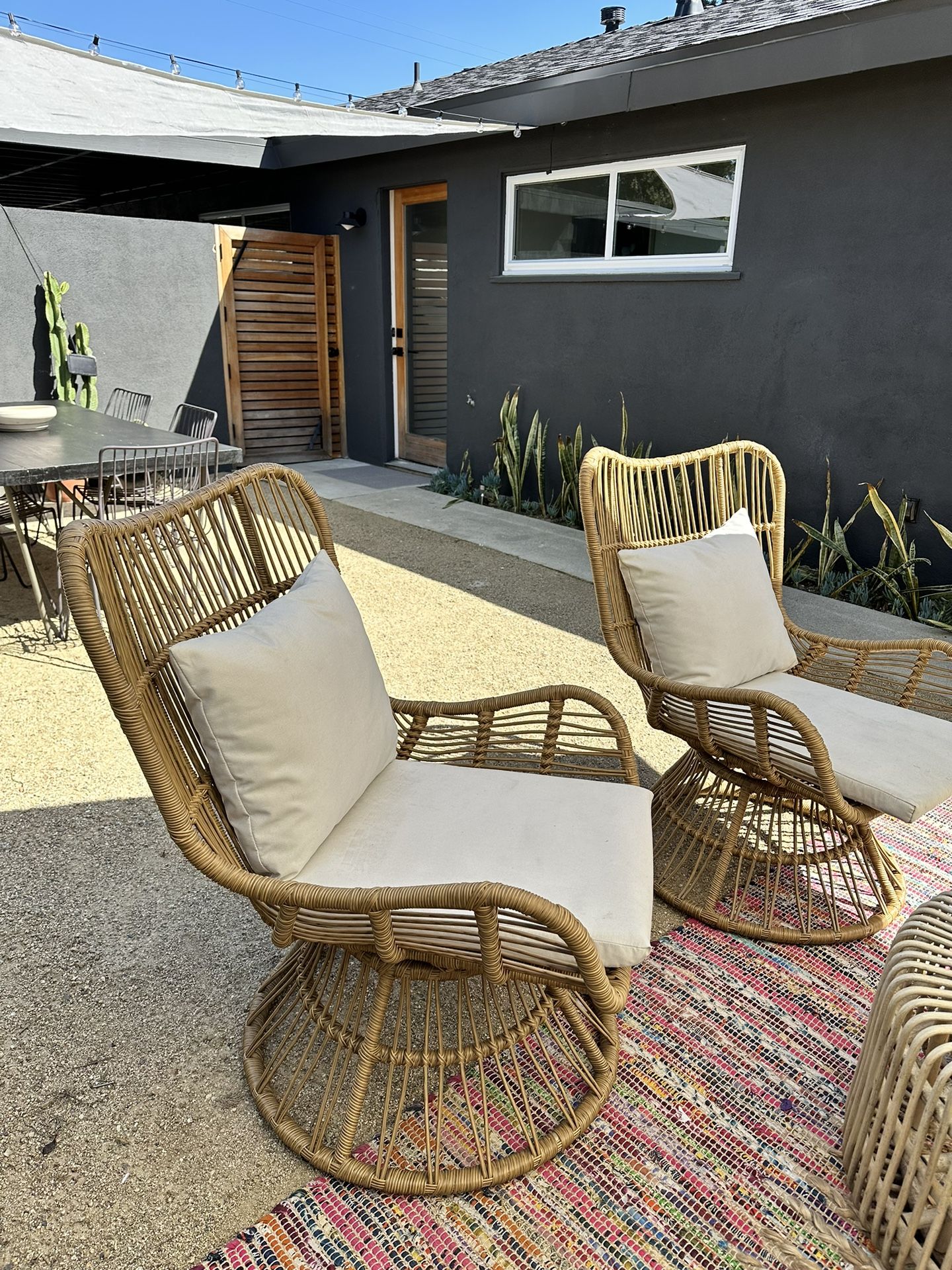 Living Spaces Rattan Swivel Chairs