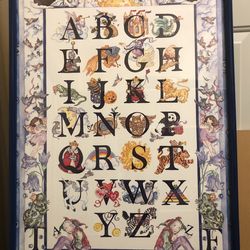 Beautiful, New, alphabet piece framed in deep blue.