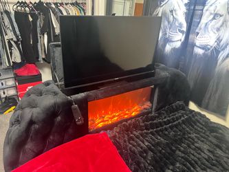 Queen bed with fire place and tv foot board