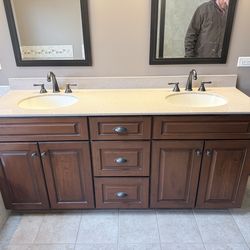Vanity with sink top and faucets