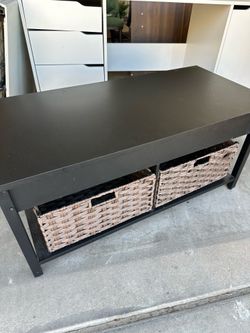 black coffee table with baskets