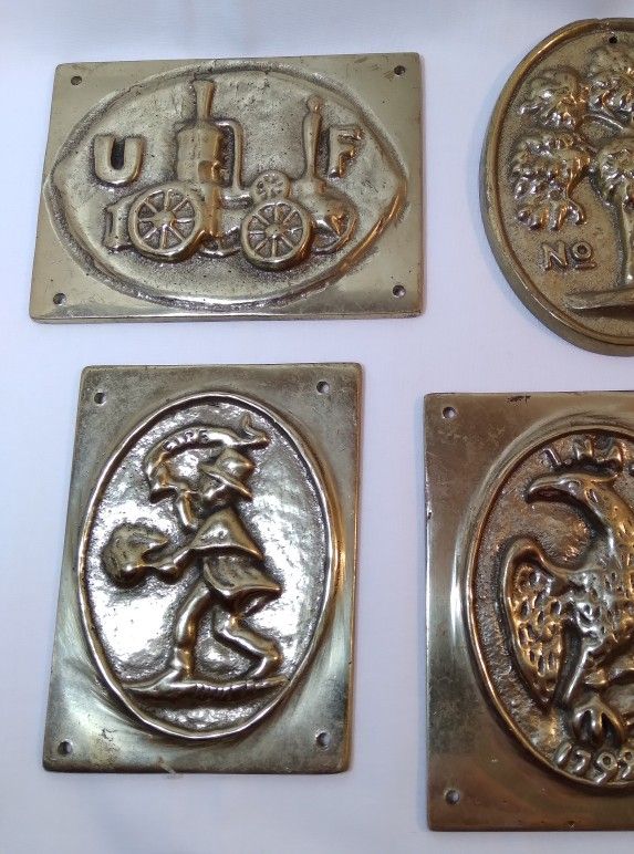 Two Embossed Brass Fire Insurance Emblems Plaques