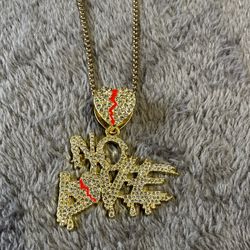 Mens new without tags. Gold No Love blinged out pendant with 24 inch gold box chain. 