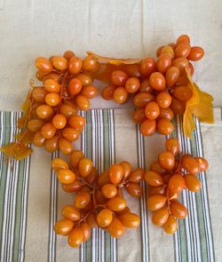 Set of 4 Artificial Orange Grape Clusters.