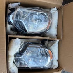 New 2015 Toyota Tacoma headlights fits 2012 to 2015 asking $175 