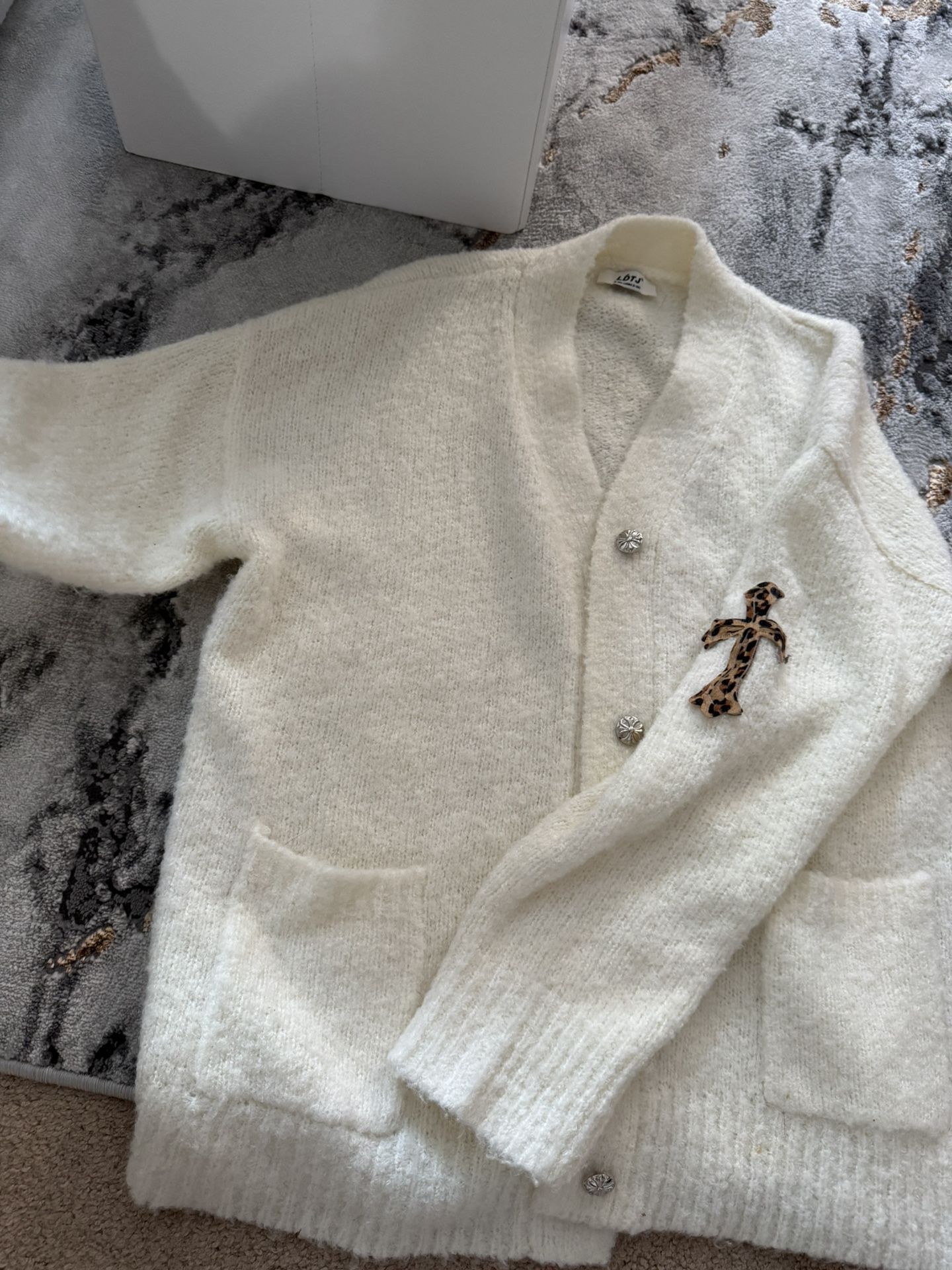 Cozy White Knit Cardigan with Leopard Brooch -