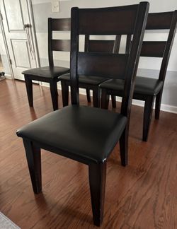 4 wood and leather dining chairs