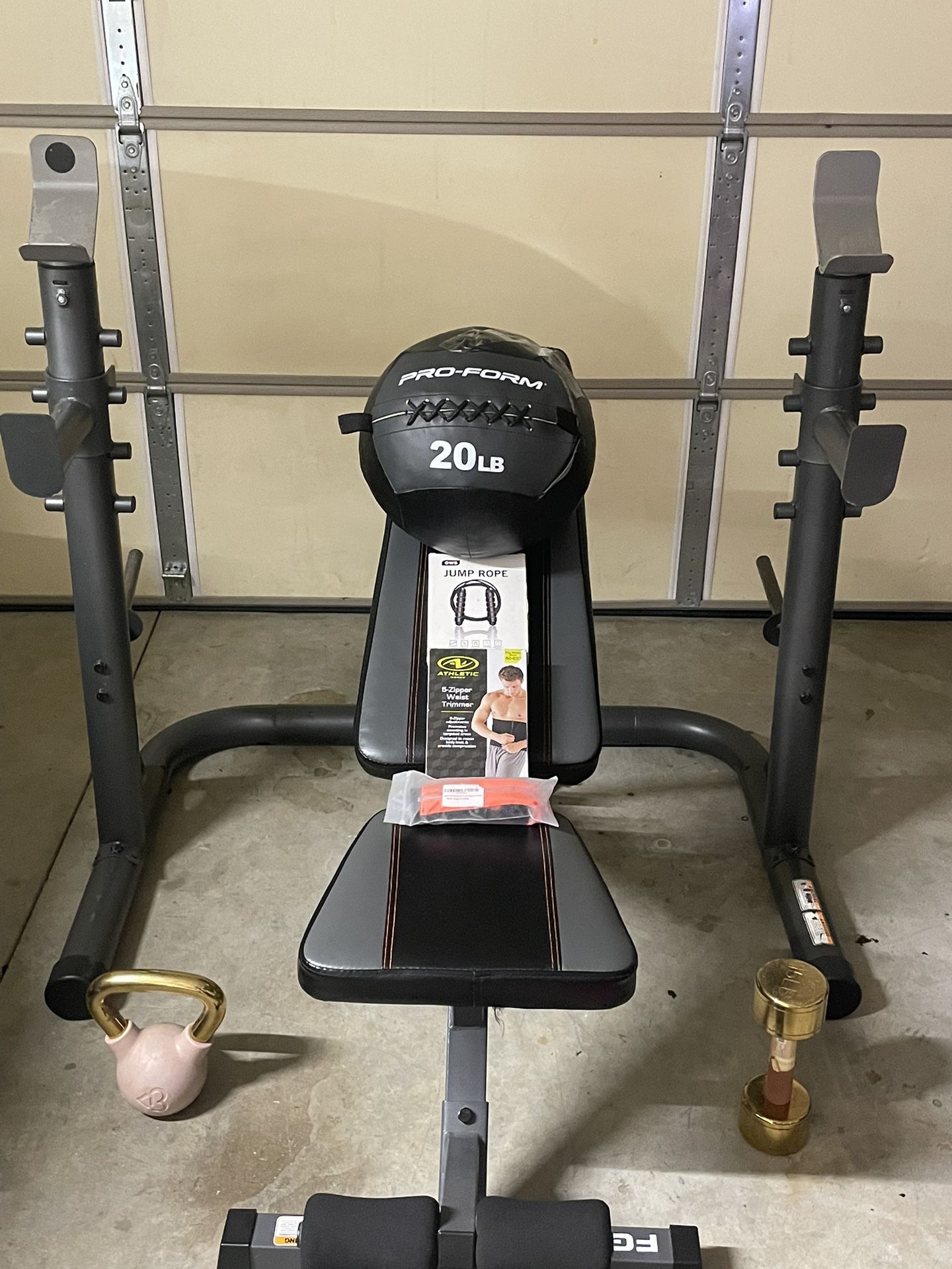 Adjustable Squat Rack Plus Adjustable Bench 20lb Weight Ball One 15lb Kettlebell One 15lb Dumbbell one jump rope one waist trimmer and one running bel