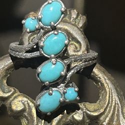 A Navajo sterling silver with six individual sleeping beauty stones turquoise