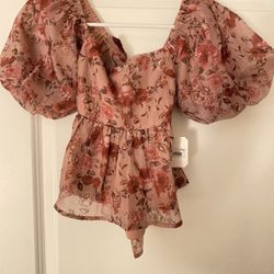 Pink floral romper with puffy sleeves Size XS