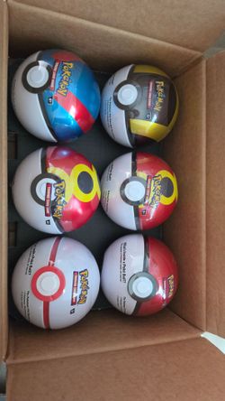 G25 Poké ball tins. Pokémon cards