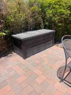 Deck or patio storage bin
