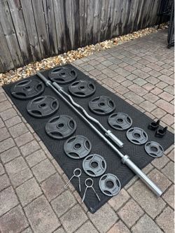2” Complete Set of Steel plates and barbells with over 310lbs in total weights. Everything in pics is included.