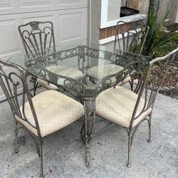 BEAUTIFUL GLASS DINING TABLE WITH IRON BASE