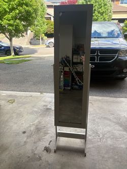 White jewelry/makeup cabinet with mirror