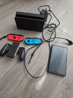 Nintendo Switch console with dock and joysticks