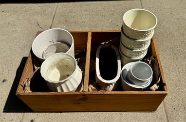 Box of small white ceramic pots