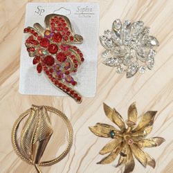 BUNDLE OF 4 LARGE BROOCHES (the goldtone is missing one red stone).2”