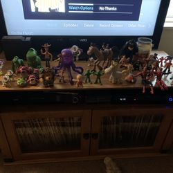 About 44 Action figures (toy story, star wars, batman etc)