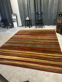 2 Matching Rugs- great condition 5x8 and 8x12