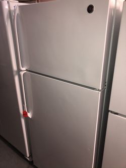 Used GE top and bottom fridge. 1 year warranty