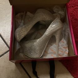 Size 7.5 silver Heels 