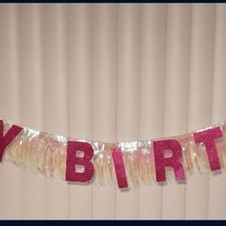 "Happy Birthday" glitter fuchsia letter banner with pink iridescent fringe
