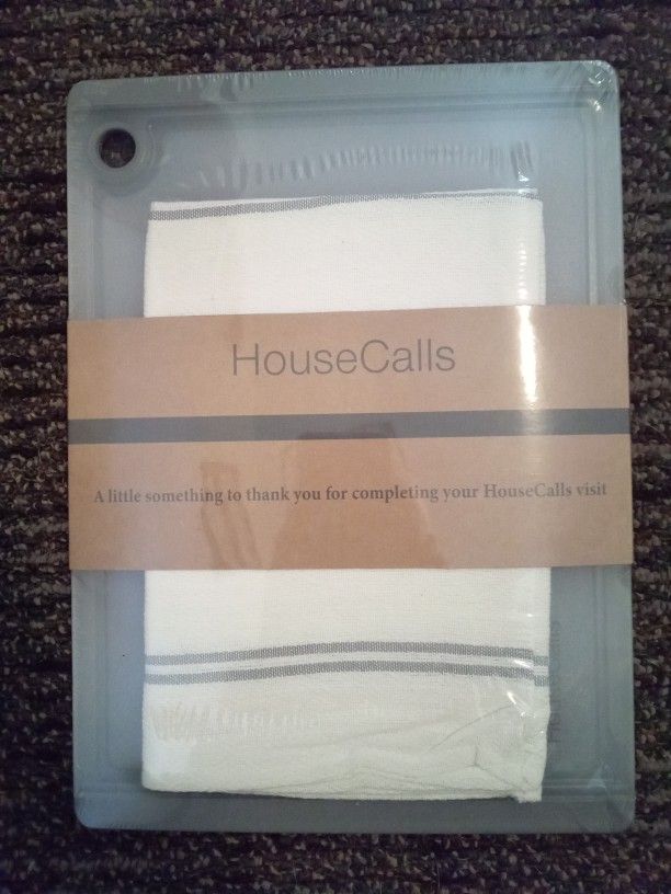 CUTTING BOARD. BRAND NEW. STILL IN PLASTIC WRAP.