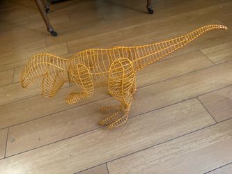 wire topiary frame shaped like a Tyrannosaurus rex (T-Rex)