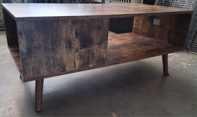 Wooden Coffee Table / TV Stand
Used but in great condition. This versatile piece can be used as a coffee table or a TV stand