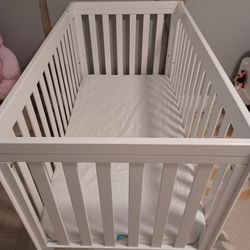 Baby crib with mattress and mattress protector.  Like new!