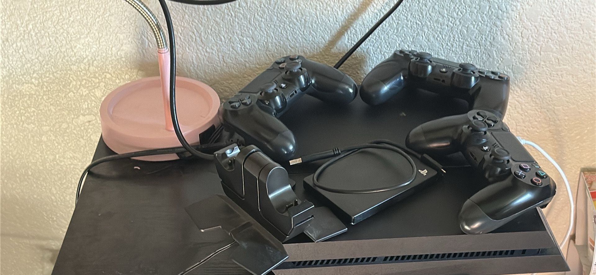 PS4 w/ 3 controllers, charging station, 1tb extra storage