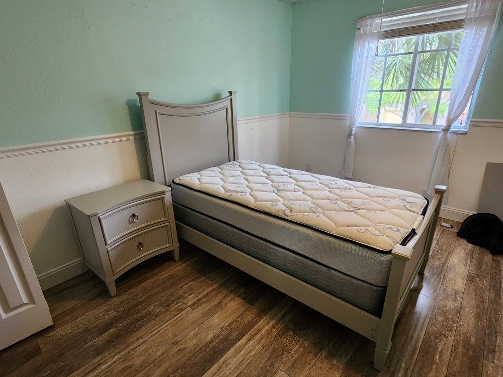 Twin bed with mattress and nightstand 