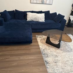 111 inch L shaped couch. Dark blue  with 9 pillows