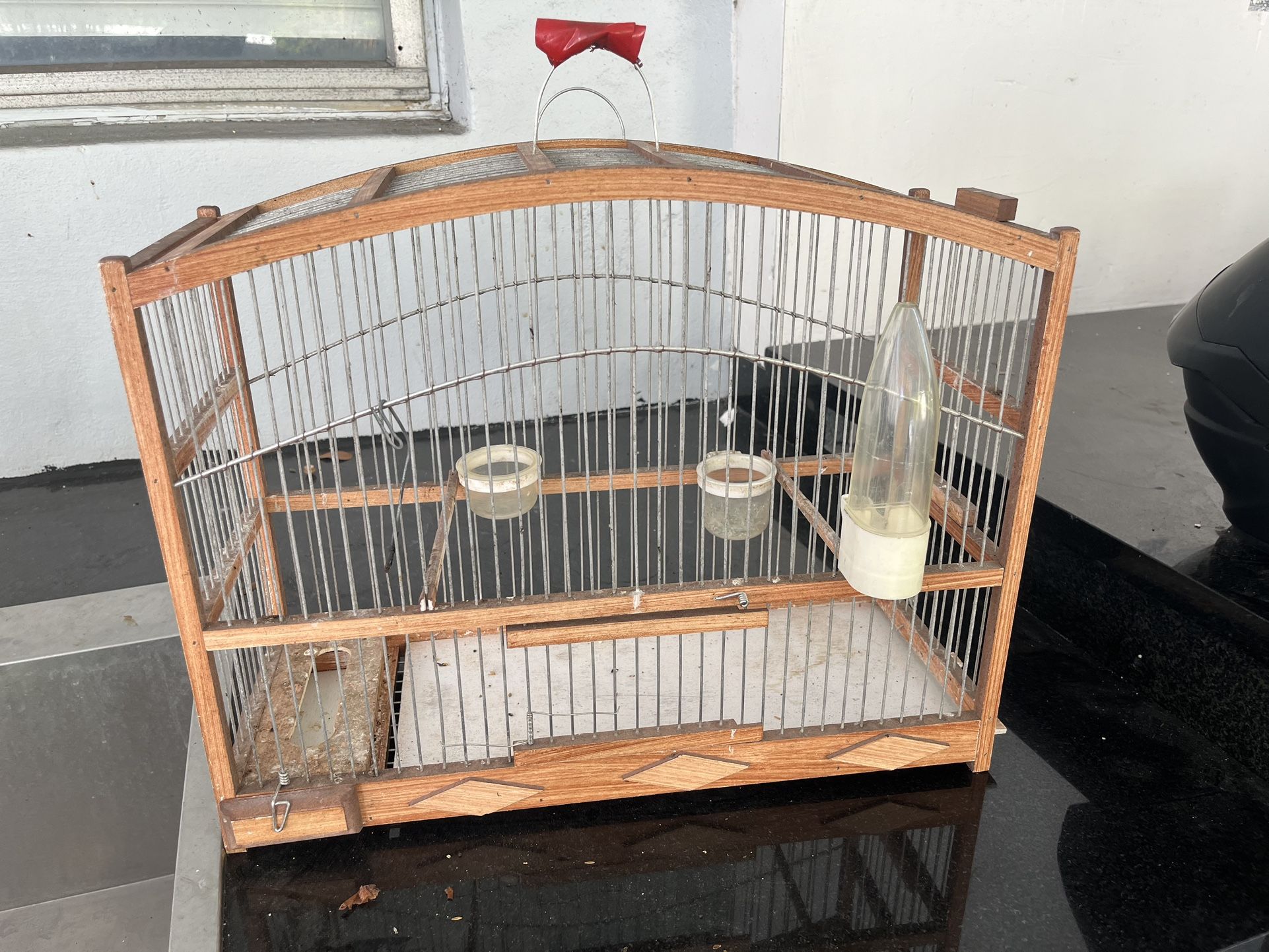 Handcrafted Wooden Bird Cage with a slide able Base and Slide-Out food Tray