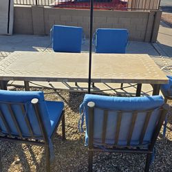 Wrought iron outdoor table and chairs were made at Arizona Iron Furniture