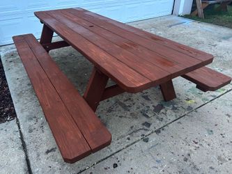 All pressure treated 8 foot picnic table with stain umbrella hole, and cut corners with delivery locally!