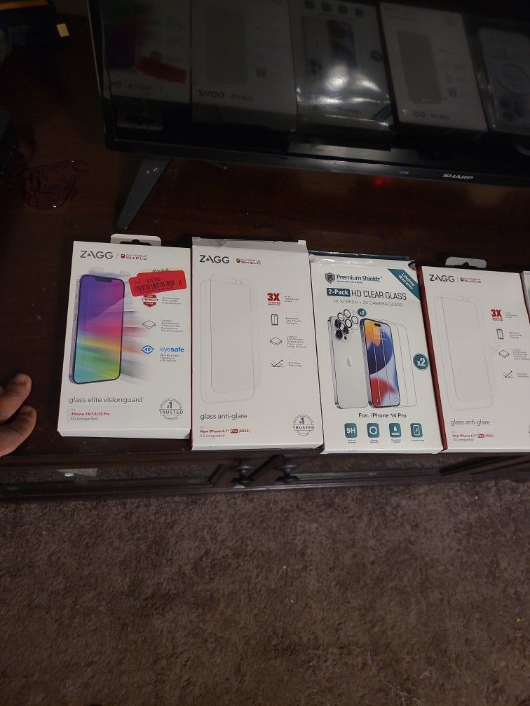 Lot Of 4 Screen Protectors And Iphone Cases 