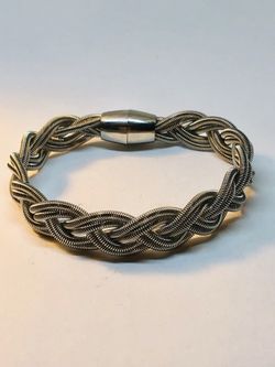 Silver tone bracelet with braided wires and magnetic clasp