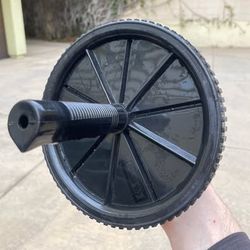 Series-8 Fitness Ab Wheel, a piece of equipment designed to strengthen core, arm, and back muscles