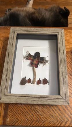 Scarecrow and pumpkins