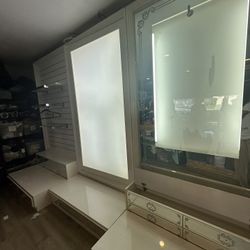 Office salon lit up display white lacquer wall unit drawers slat wall custom made glass  hanging rod