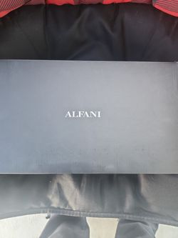 The Brand is ALFANI color black size 7.5