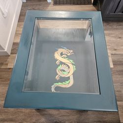 Wood glass top living room stand with glow in the dark Dragon design.