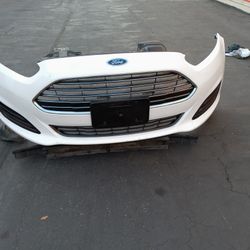 Ford Fiesta Front Bumper With Grill And Emblem And Fog Lights With Accessories OEM. 