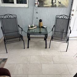2 Iron Rocking Chairs With The Table