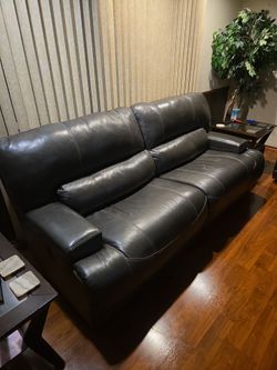 Dark Brown Ashley Furniture Recliner and Love Seat Recliner