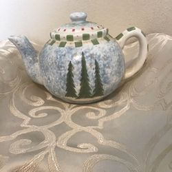 Christmas Teapot by Angie Anderson beautiful holiday trees with stars a light blue backgroun background